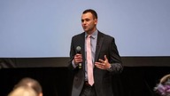 Aaron Golub speaking to audience