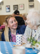 Carer with client at table